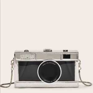 She in camera designs chain crossbody bag